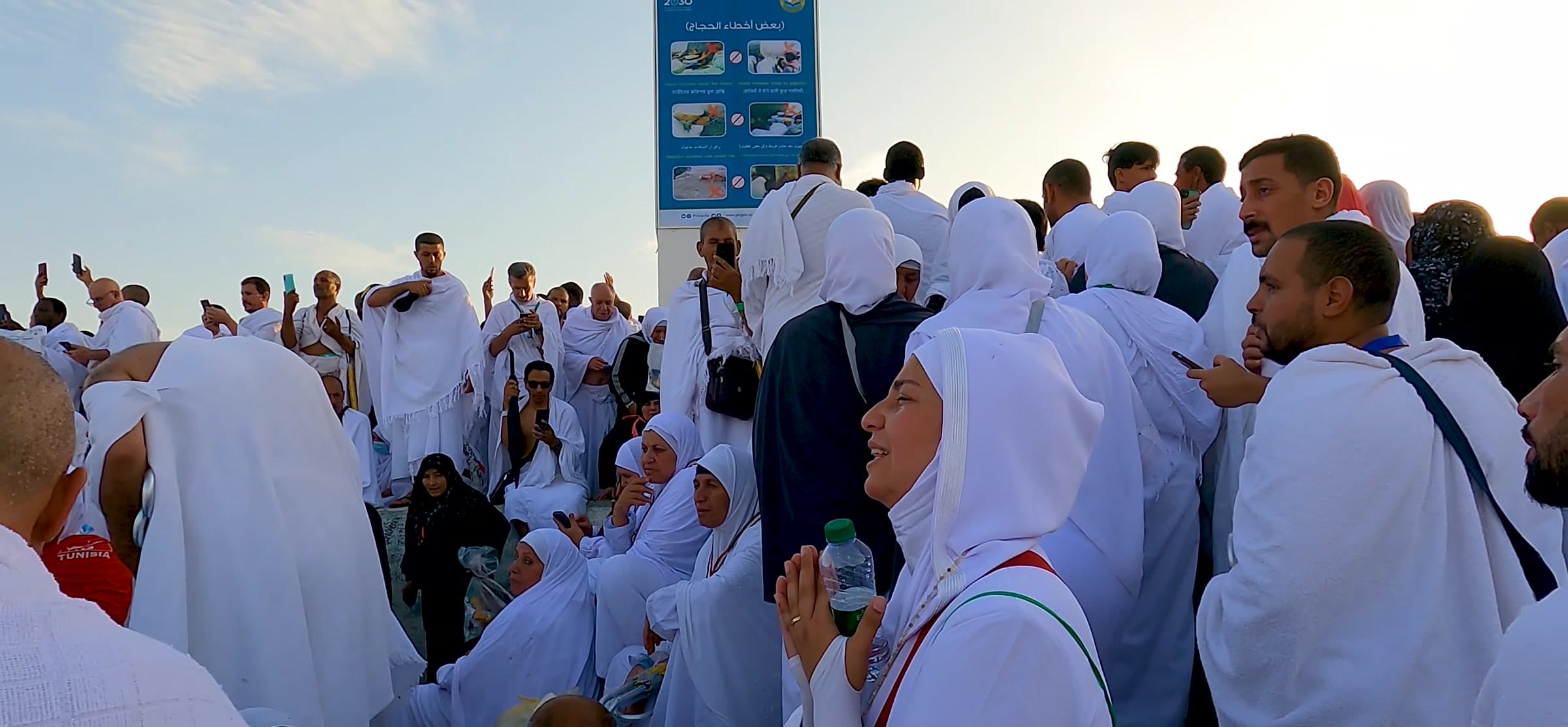 Pilgrims in ihram gathered together.